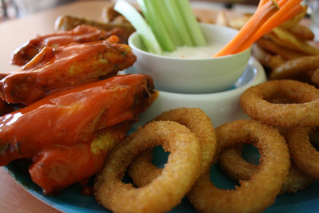 onion rings with dip and hot wings